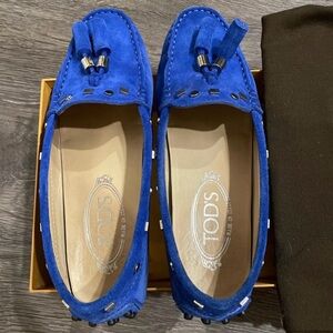 Blue suede Tod's Gommino City loafers with studs and tassel